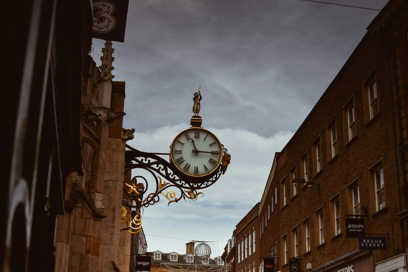 The Eastgate Clock above Eastgate Street in Chester, with black-and-white timbered buildings below