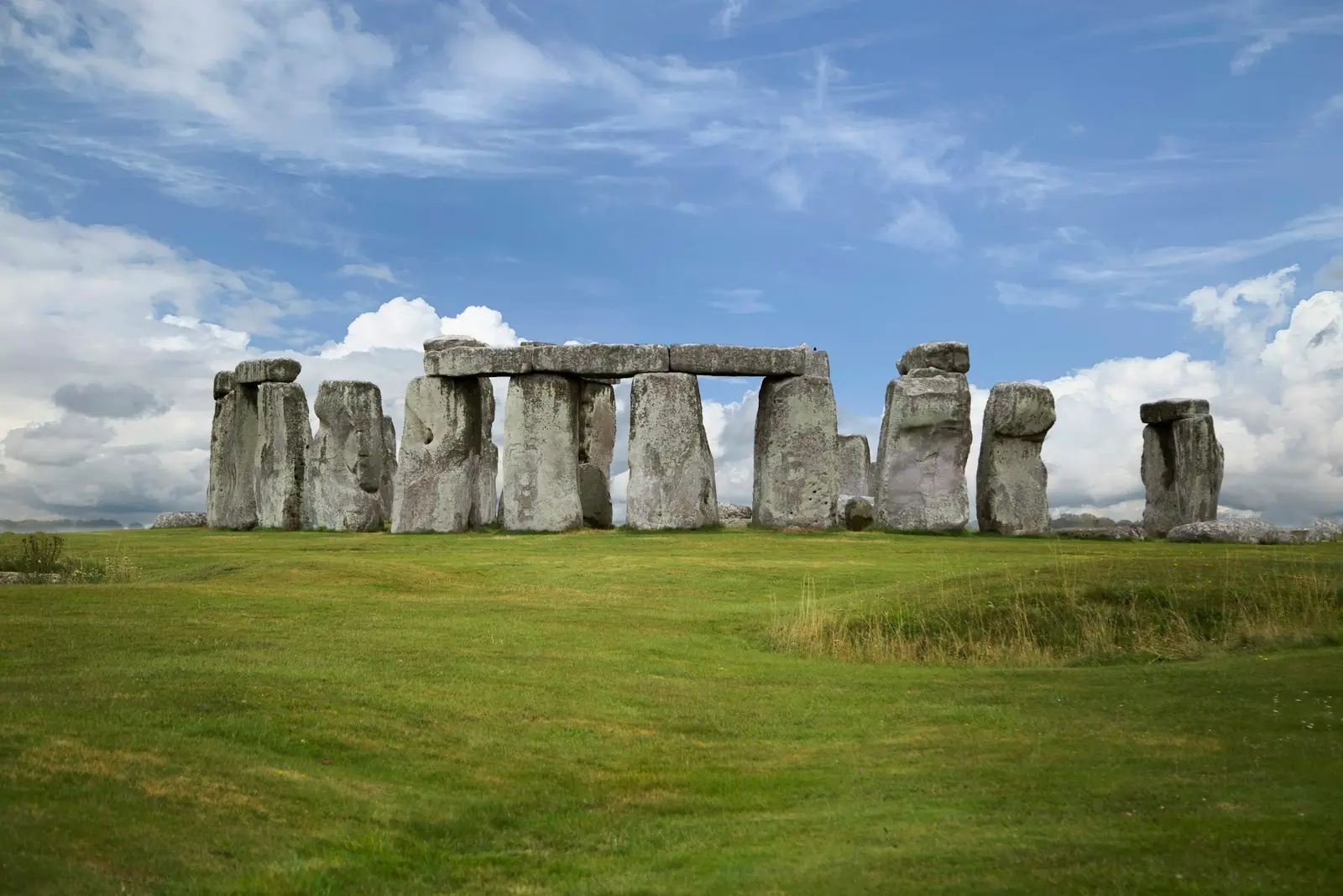 The standing stones of Stonehenge silhouetted against a dramatic evening sky on Salisbury Plain